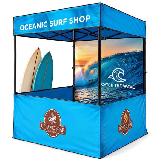 Customised blue promotional canopy tent with Oceanic Surf Shop branding, printed side panels and surf artwork, photographed on a clean white background.