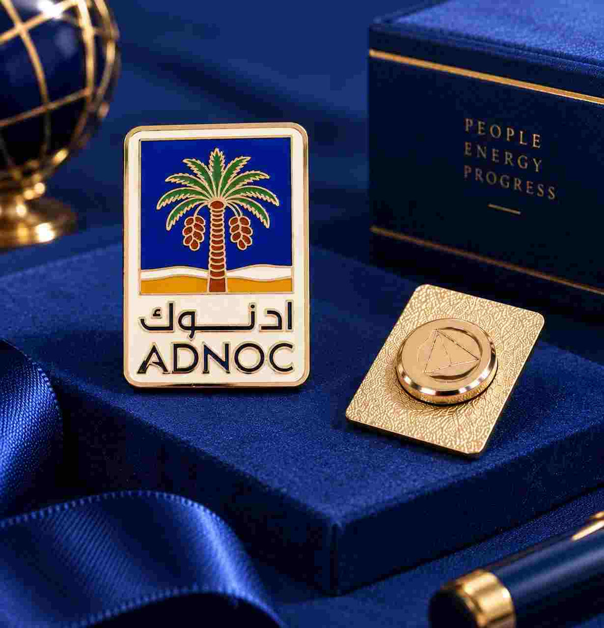1. Personalized logo lapel pin displayed with a royal blue gift box and elegant corporate gifting setup.