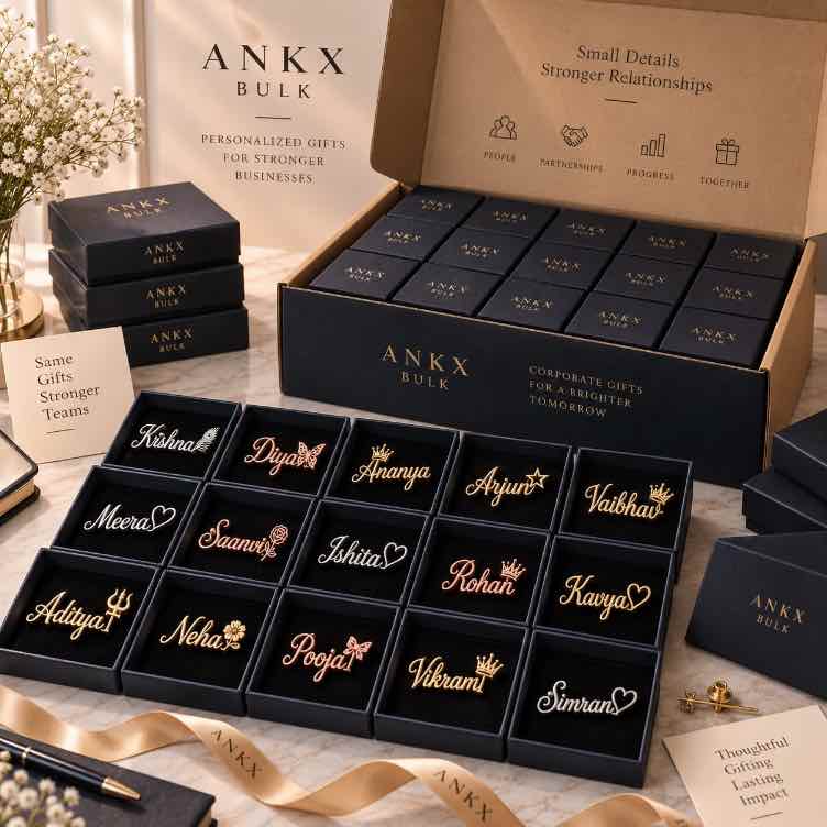 Personalized gold rose gold and silver name brooches displayed in individual black boxes as a premium bulk corporate gifting collection