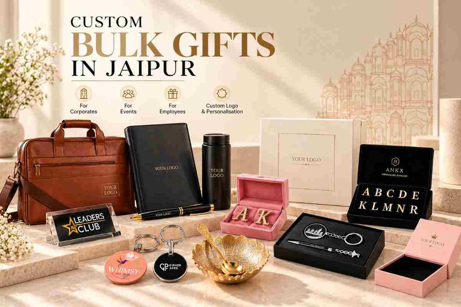 Custom bulk gifts in Jaipur by ANKX Bulk, featuring personalized corporate gift boxes, branded leather bags, stationery, engraved keychains, jewellery, and premium corporate gifting sets on a minimal beige background.