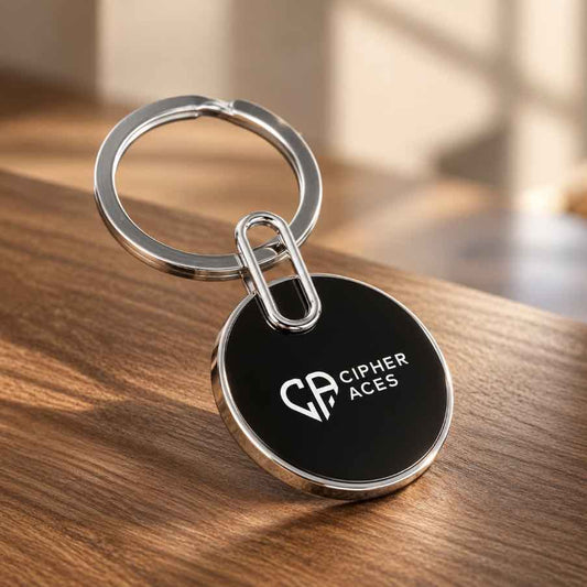 Black personalized CIPHER ACES keychain with silver metal ring showcased on a premium wooden surface