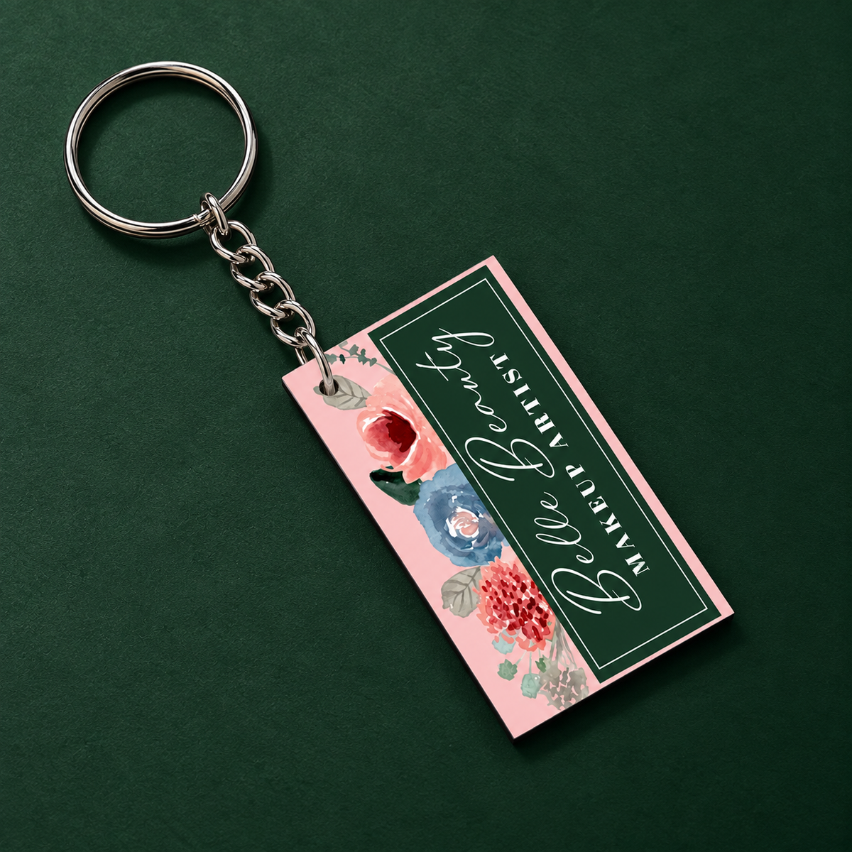 Personalized pink floral acrylic keychain with dark green thank you message, silver chain and keyring displayed on a deep green background
