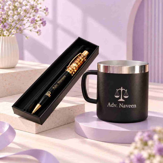 Personalized black and gold pen and mug corporate gift set displayed in a soft pastel purple setting