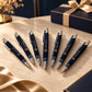 personalized navy blue pens featuring gold YOUR LOGO branding displayed on a luxurious wooden executive desk, perfect for corporate gifts, branded office stationery, business gifts, and promotional giveaways.