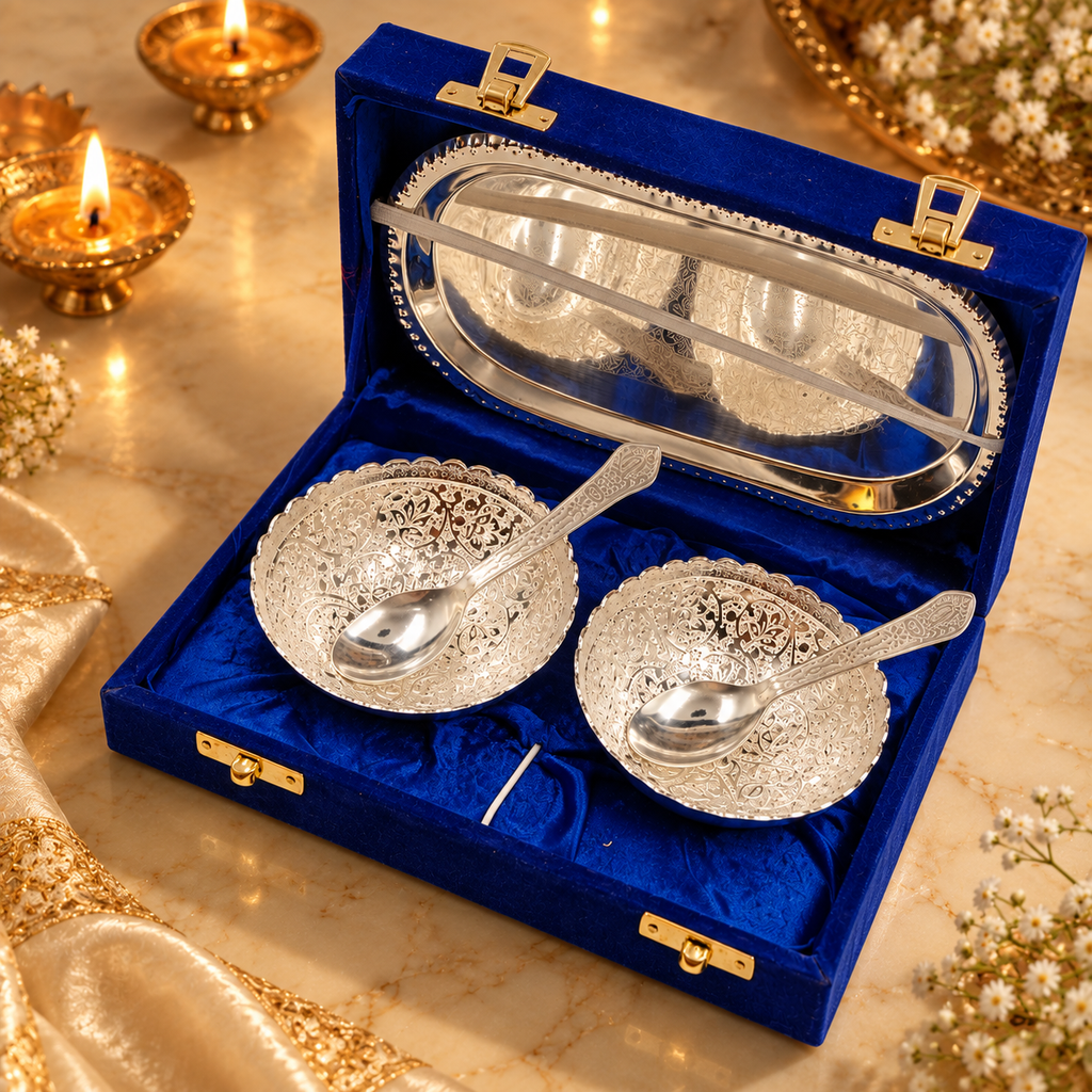 Ornate silver bowl and spoon gift set presented in a royal blue velvet box with silver tray

