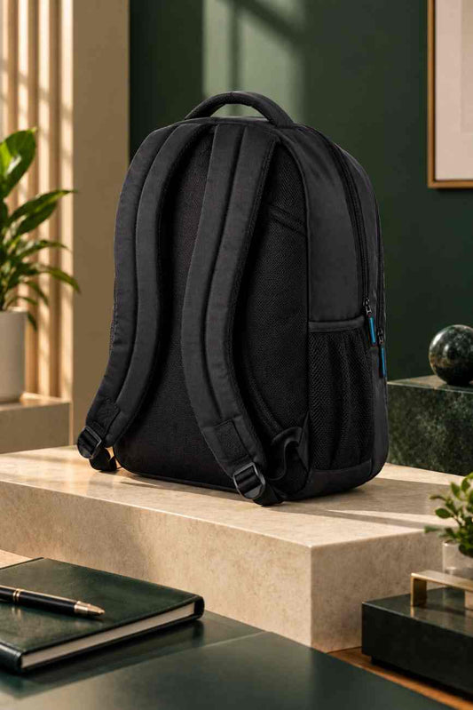 Black custom logo backpack photographed from a rear-left angle with lime green and purple geometric styling