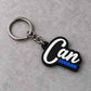 Custom MST Motion Systems Technology keychain with black and blue gear design, white MST lettering, silver chain and metal keyring on a light textured surface.
