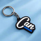 A black and silver keychain with a custom nameplate reading 'Can DOOSAN' in white and blue lettering, shown on a light blue textured background.