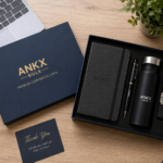 Premium bulk corporate gifting workspace featuring an ANKX Bulk gift set with notebook, pen, insulated bottle, keychain, and branded gift box for employee and client gifting.